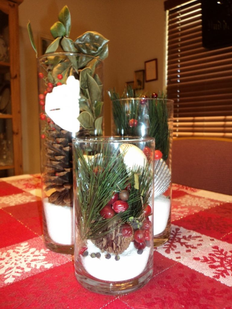 jar with pinecone and berries