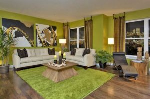 Green living room with pictures on the wall